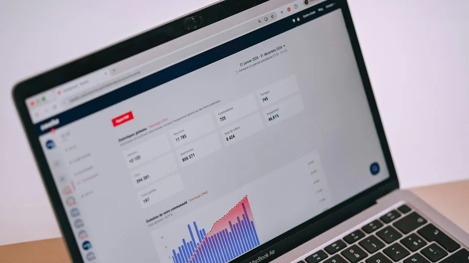 An analytics dashboard on a laptop represents digital campaign measurement.