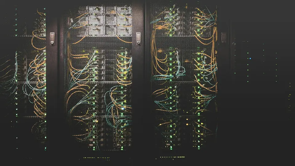 Server racks connected by a dense network of cables, representing the infrastructure behind AI computing.